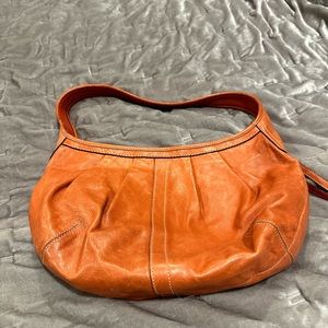 Orange leather coach bag